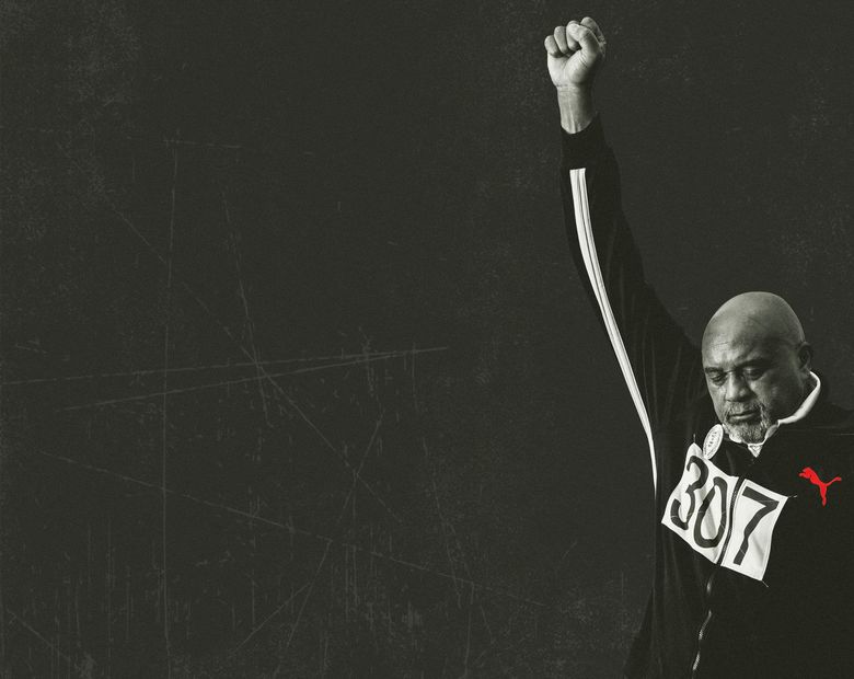 Tommie Smith raising his fist in protest.
