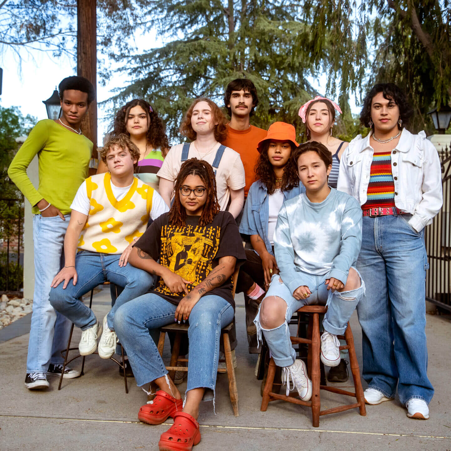 Group of LGBTQ young people standing together and looking into the camera