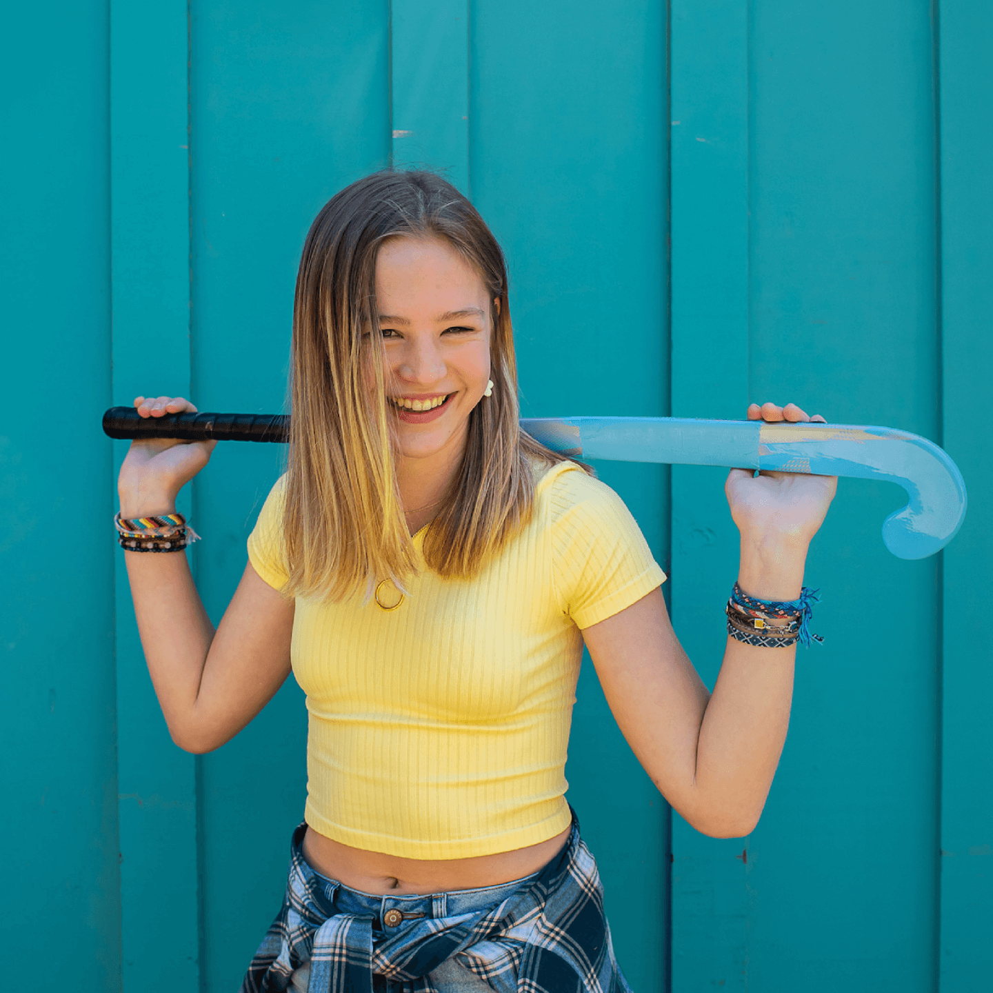 Smiling person in a yellow shirt