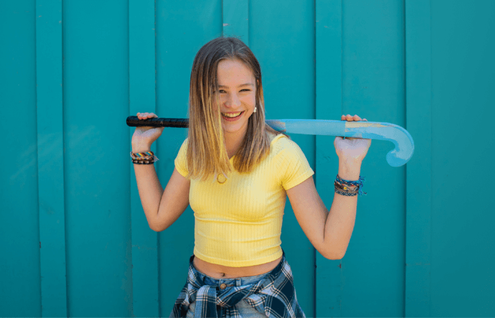 Smiling person in a yellow shirt