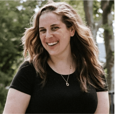 A photo of a smiling Caitlin Clark, the National Survey Manager at The Trevor Project.