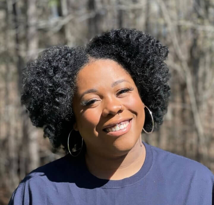 A headshot of a smiling Dr. Tiffany Eden (she/her)