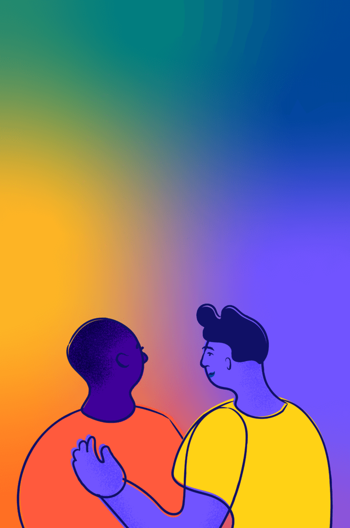 Two young people put arms on each other's shoulders and look out at the horizon